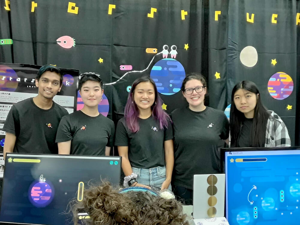 a group photo at our BostonFIG booth